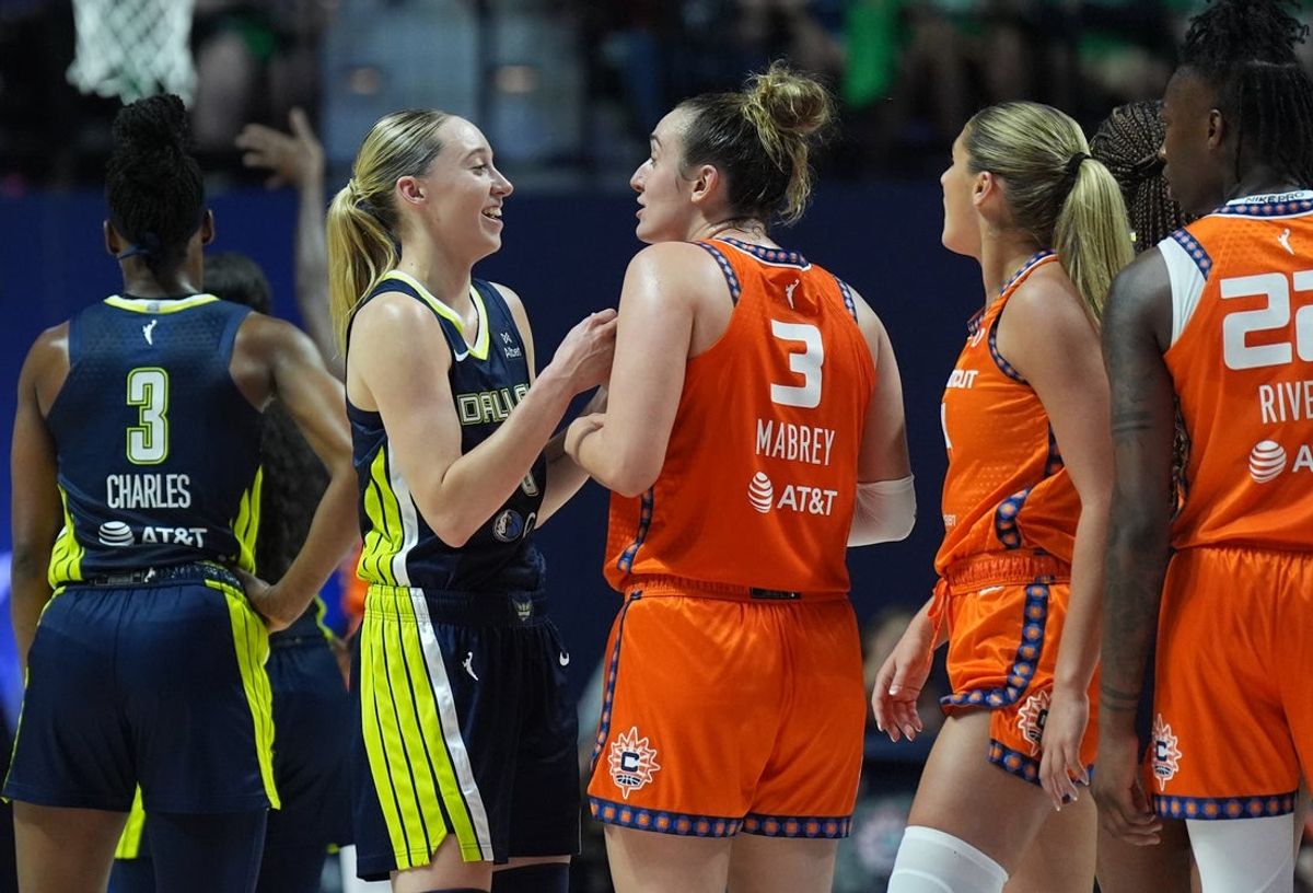 Jun 20, 2025; Uncasville, Connecticut, USA; Dallas Wings guard Paige Bueckers (5) talks with Connecticut Sun guard Marina Mabrey (3) after a play in the first half at Mohegan Sun Arena. Mandatory Credit: David Butler II-Imagn Images