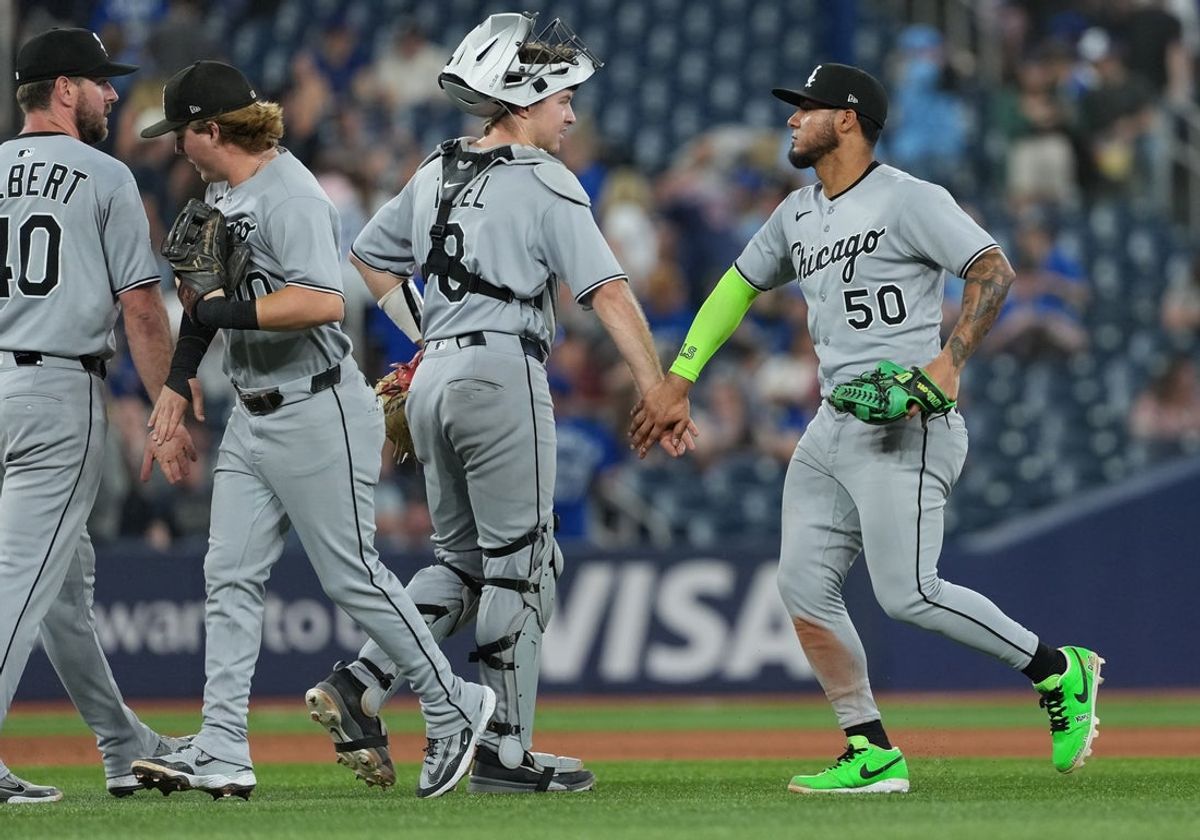 Jun 20, 2025; Toronto, Ontario, CAN; Chicago White Sox catcher Kyle Teel (8) celebrates the win with second baseman  Lenyn Sosa (50) against the Toronto Blue Jays at the end of the ninth inning at Rogers Centre. Mandatory Credit: Nick Turchiaro-Imagn Images