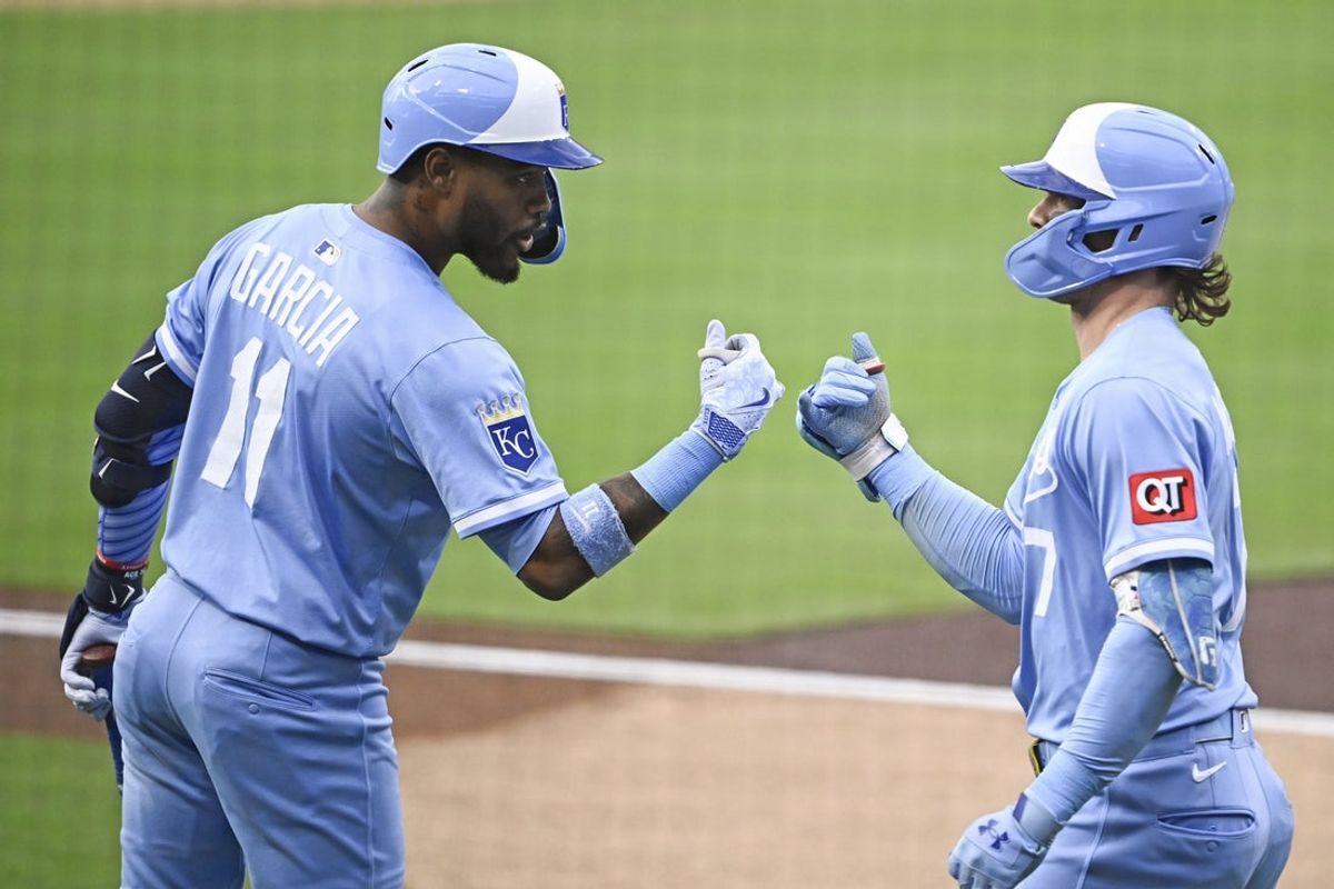 Jun 20, 2025; San Diego, California, USA; Kansas City Royals shortstop Bobby Witt Jr. (7) is congratulated by Maikel Garcia (11) after hitting a solo home run during the first inning against the against the against the San Diego Padres at Petco Park. Mandatory Credit: Denis Poroy-Imagn Images