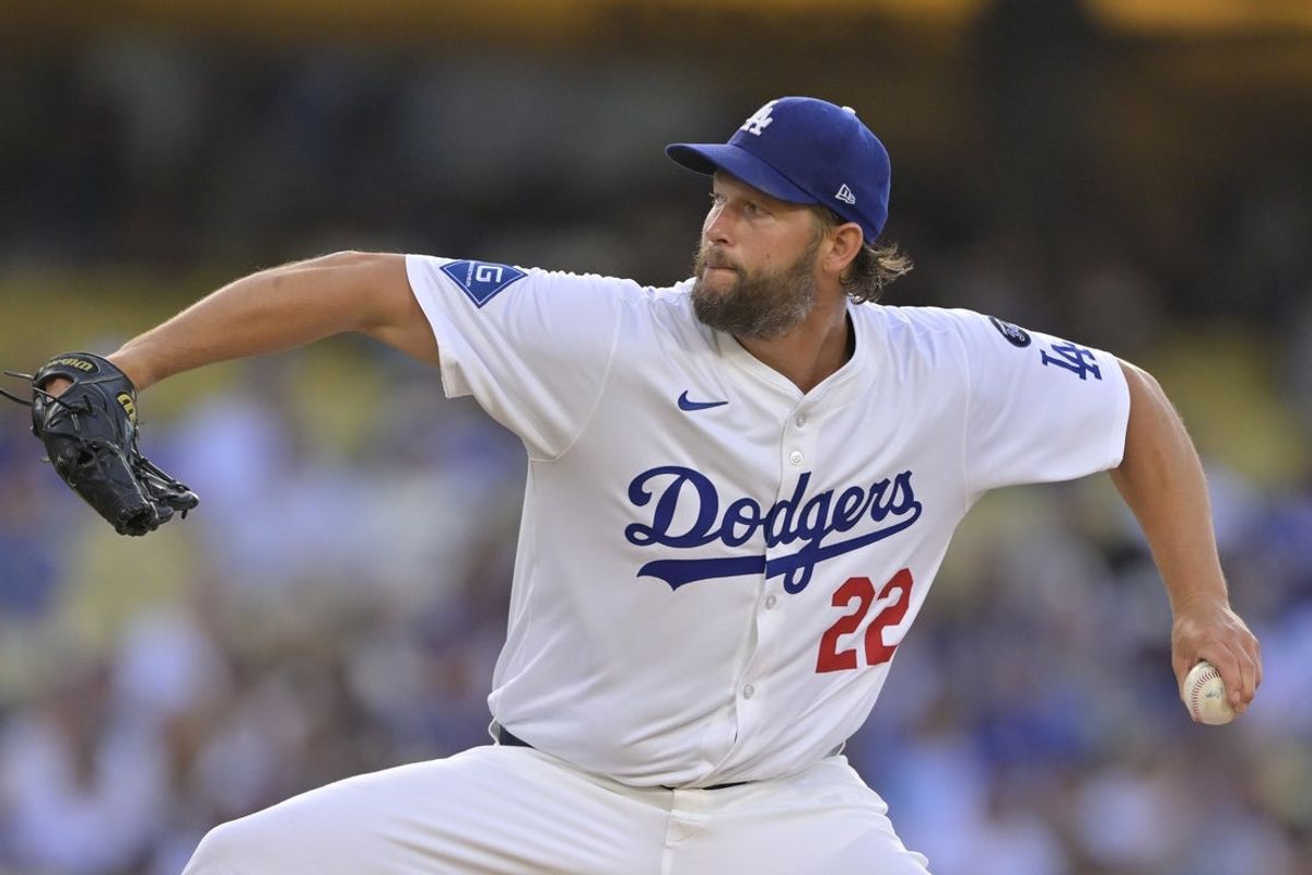 Jun 20, 2025; Los Angeles, California, USA;  Los Angeles Dodgers pitcher Clayton Kershaw (22) delivers a pitch during the first inning against the Washington Nationals at Dodger Stadium. Mandatory Credit: Jayne Kamin-Oncea-Imagn Images