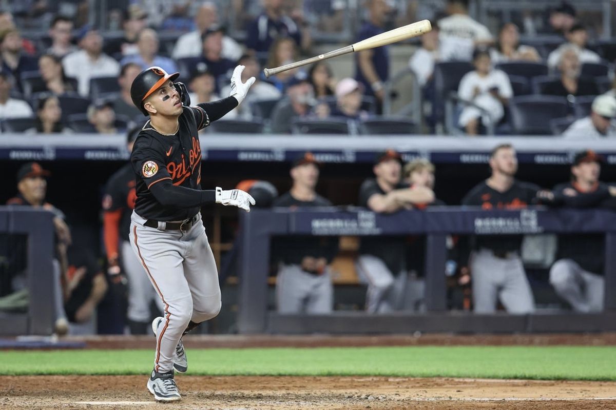 Jun 20, 2025; Bronx, New York, USA;  Baltimore Orioles third baseman Ramón Urías (29) hits a solo home run in the eighth inning against the New York Yankees at Yankee Stadium. Mandatory Credit: Wendell Cruz-Imagn Images