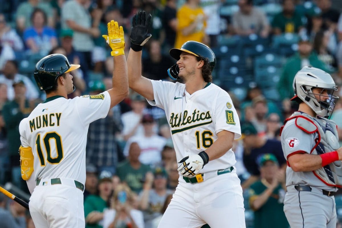 Jun 20, 2025; West Sacramento, California, USA; Athletics first baseman Nick Kurtz (16) celebrates with third baseman Max Muncy (10) after hitting a two run home run during the first inning against the Cleveland Guardians at Sutter Health Park. Mandatory Credit: Sergio Estrada-Imagn Images
