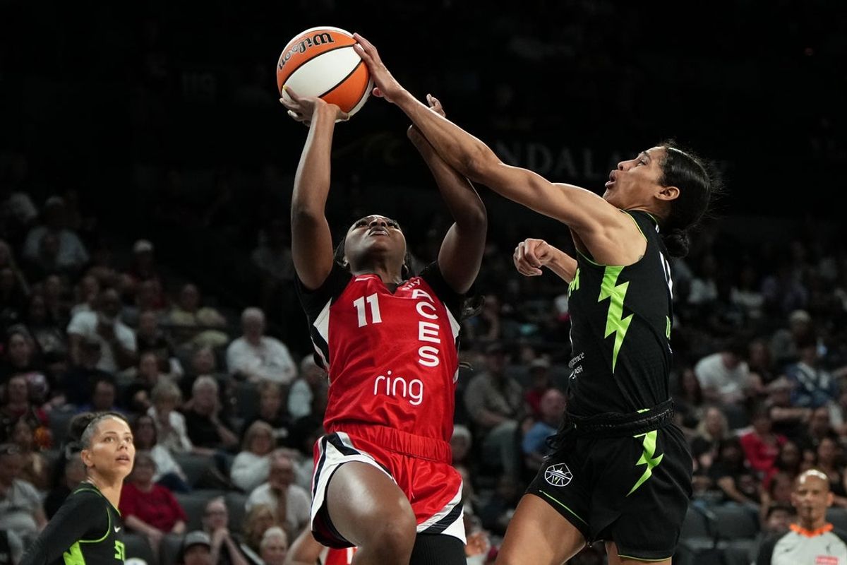 Jun 20, 2025; Las Vegas, Nevada, USA; guard Skylar Diggins (4) blocks a layup by Las Vegas Aces guard Dana Evans (11) during the first half of a WNBA basketball game at Michelob Ultra Arena. Mandatory Credit: Lucas Peltier-Imagn Images