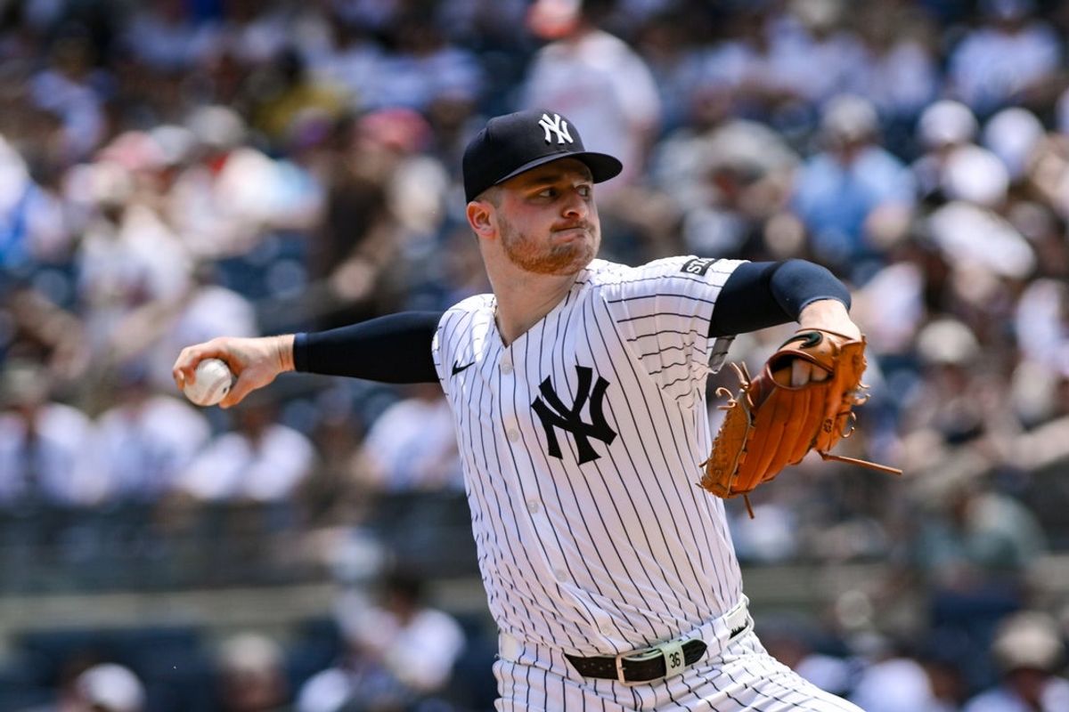 Jun 21, 2025; Bronx, New York, USA; New York Yankees pitcher Clarke Schmidt (36) pitches against the Baltimore Orioles during the first inning at Yankee Stadium. Mandatory Credit: John Jones-Imagn Images