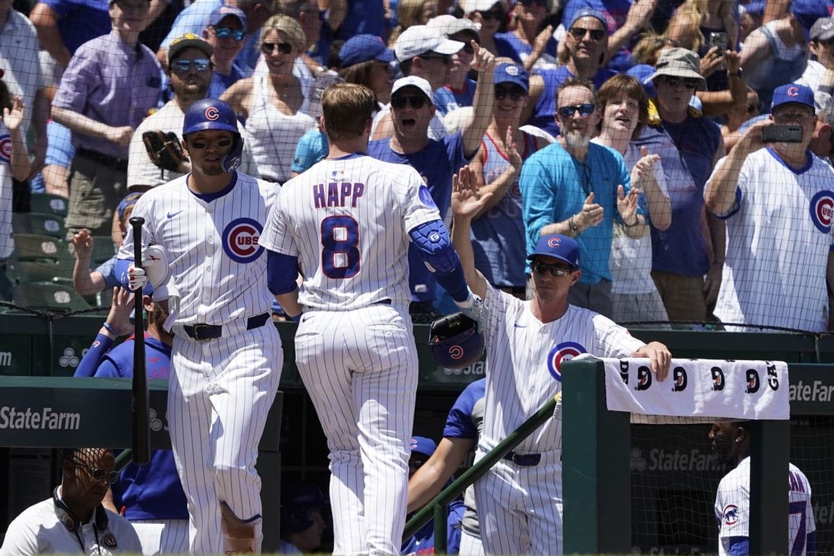 Jun 21, 2025; Chicago, Illinois, USA; Chicago Cubs outfielder Ian Happ (8)is greeted by designated hitter Seiya Suzuki (27) after hitting a home run Seattle Mariners during the first inning  at Wrigley Field. Mandatory Credit: David Banks-Imagn Images