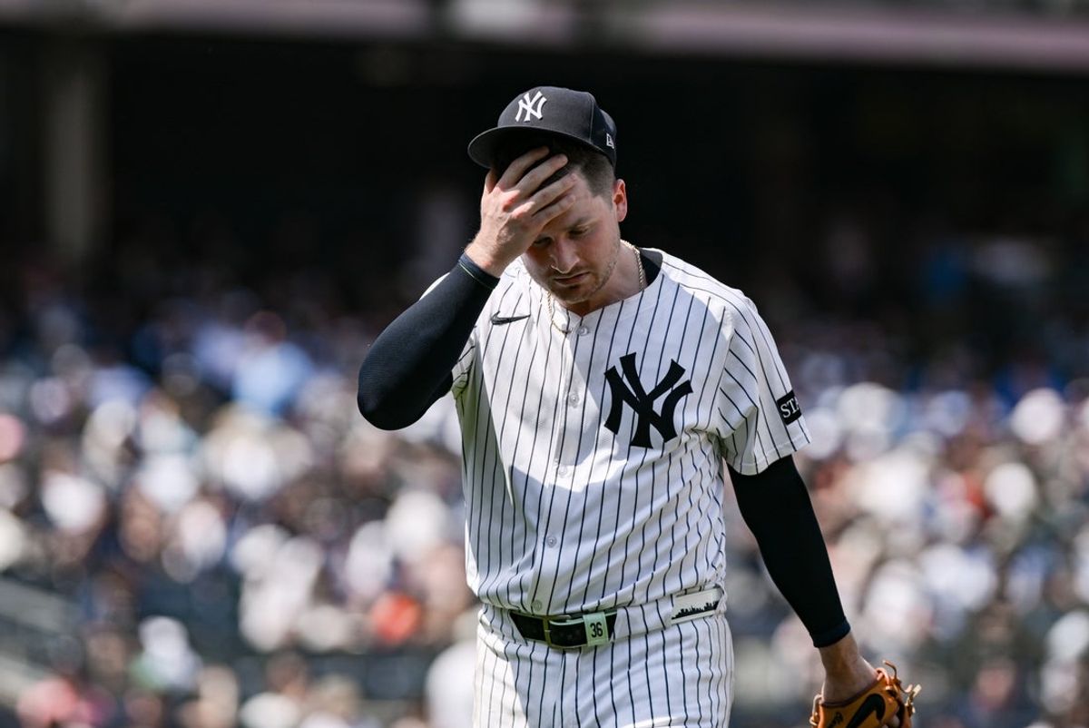 Jun 21, 2025; Bronx, New York, USA; New York Yankees pitcher Clarke Schmidt (36) reacts to the hot weather during the fifth inning against the Baltimore Orioles at Yankee Stadium. Mandatory Credit: John Jones-Imagn Images