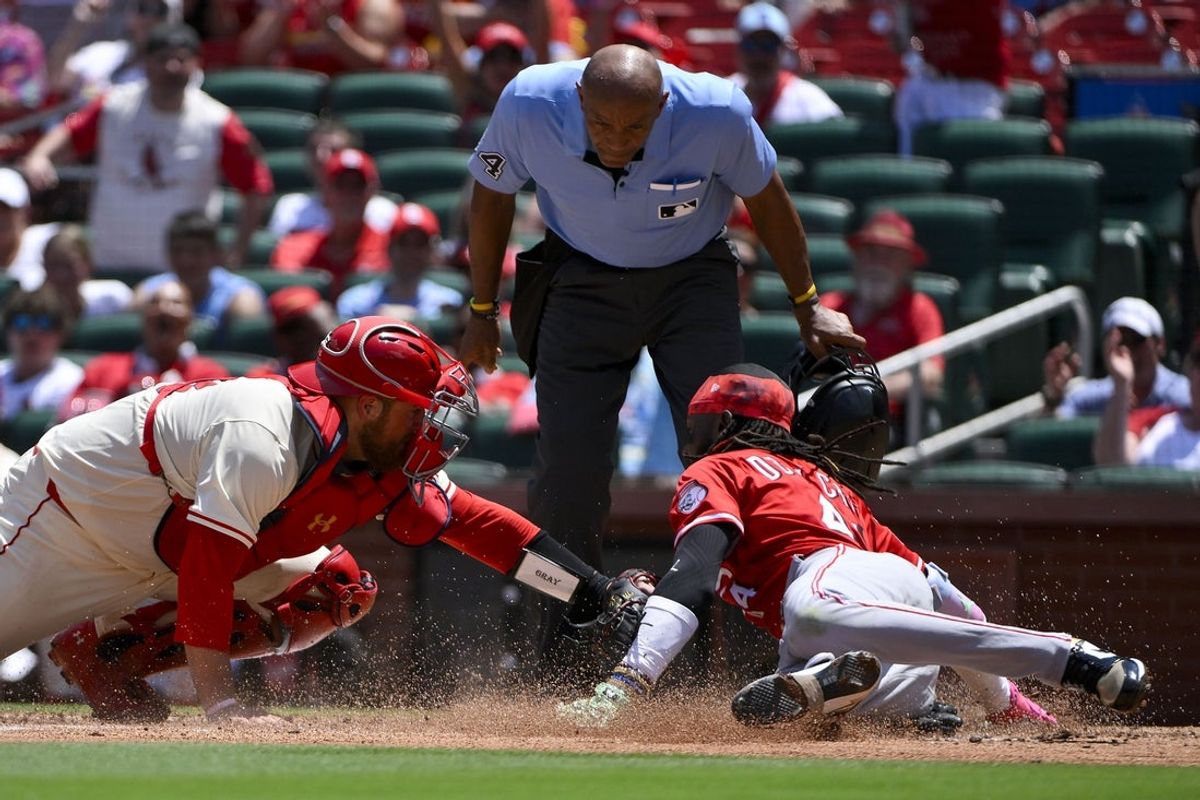 Jun 21, 2025; St. Louis, Missouri, USA;  St. Louis Cardinals catcher Pedro Pages (43) tags out Cincinnati Reds shortstop Elly De La Cruz (44) at home during the third inning at Busch Stadium. Mandatory Credit: Jeff Curry-Imagn Images