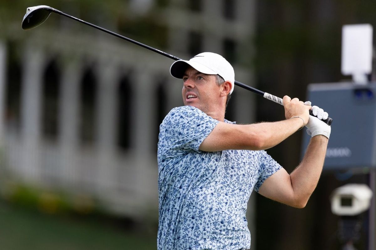 Jun 21, 2025; Cromwell, Connecticut, USA; Rory McIlroy plays his shot from the 18th tee during the third round of the Travelers Championship golf tournament. Mandatory Credit: Bill Streicher-Imagn Images