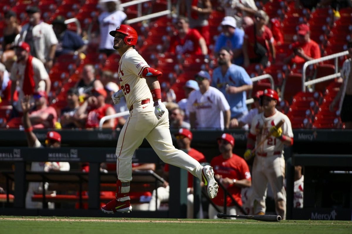 Jun 21, 2025; St. Louis, Missouri, USA;  St. Louis Cardinals third baseman Nolan Arenado (28) looks on as he runs down the line after hitting a game tying solo home run against the Cincinnati Reds during the ninth inning at Busch Stadium. Mandatory Credit: Jeff Curry-Imagn Images