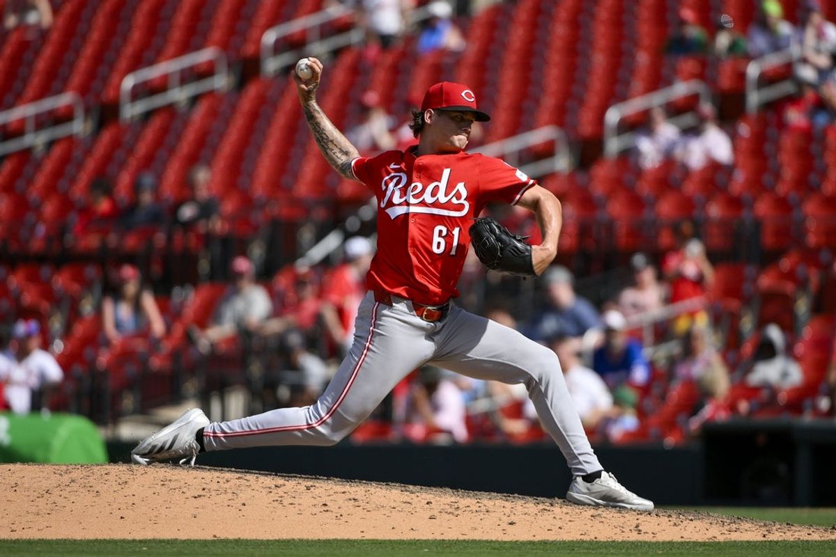 Jun 21, 2025; St. Louis, Missouri, USA;  Cincinnati Reds relief pitcher Chase Petty (61) pitches against the St. Louis Cardinals during the eleventh inning at Busch Stadium. Mandatory Credit: Jeff Curry-Imagn Images