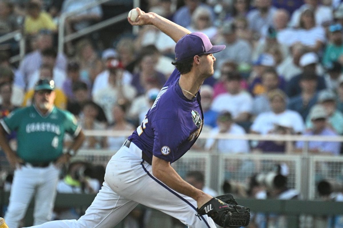 Jun 21, 2025; Omaha, Neb, USA;  LSU Tigers starting pitcher Kade Anderson (32) throws against the Coastal Carolina Chanticleers during the first inning at Charles Schwab Field. Mandatory Credit: Steven Branscombe-Imagn Images