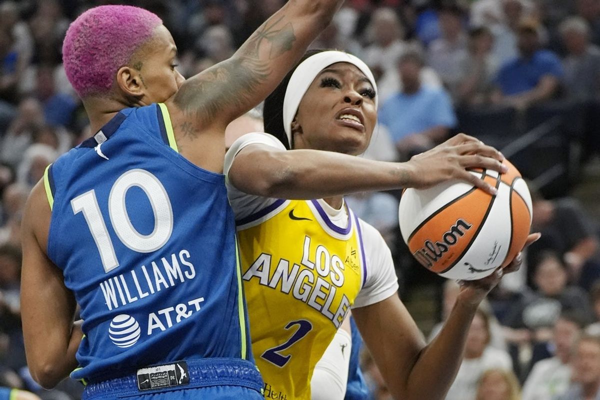 Jun 21, 2025; Minneapolis, Minnesota, USA; Los Angeles Sparks forward Rickea Jackson (2) goes to the basket against Minnesota Lynx guard Courtney Williams (10) in the first quarter at Target Center. Mandatory Credit: Bruce Kluckhohn-Imagn Images