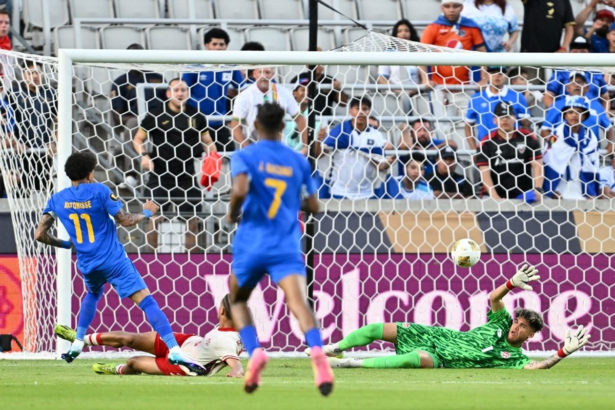 Jun 21, 2025; Houston, Texas, USA; Curacao forward Jeremy Antonisse (11) watches as his shot gets pase Canada goalkeeper Dayne St. Clair (1) to score a goal in the second half during a group stage match of the 2025 Gold Cup at Shell Energy Stadium. Mandatory Credit: Maria Lysaker-Imagn Images
