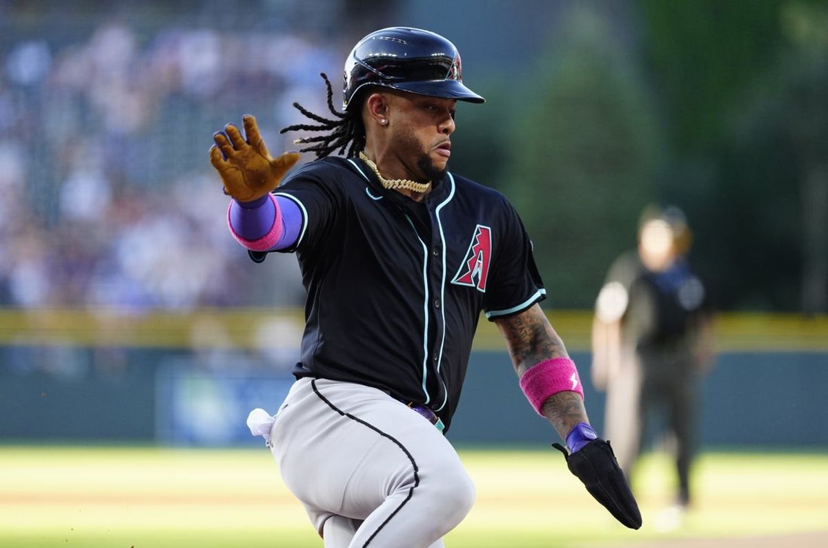 Jun 21, 2025; Denver, Colorado, USA; Arizona Diamondbacks second baseman Ketel Marte (4) scores a run in in the first inning against the Colorado Rockies at Coors Field. Mandatory Credit: Ron Chenoy-Imagn Images