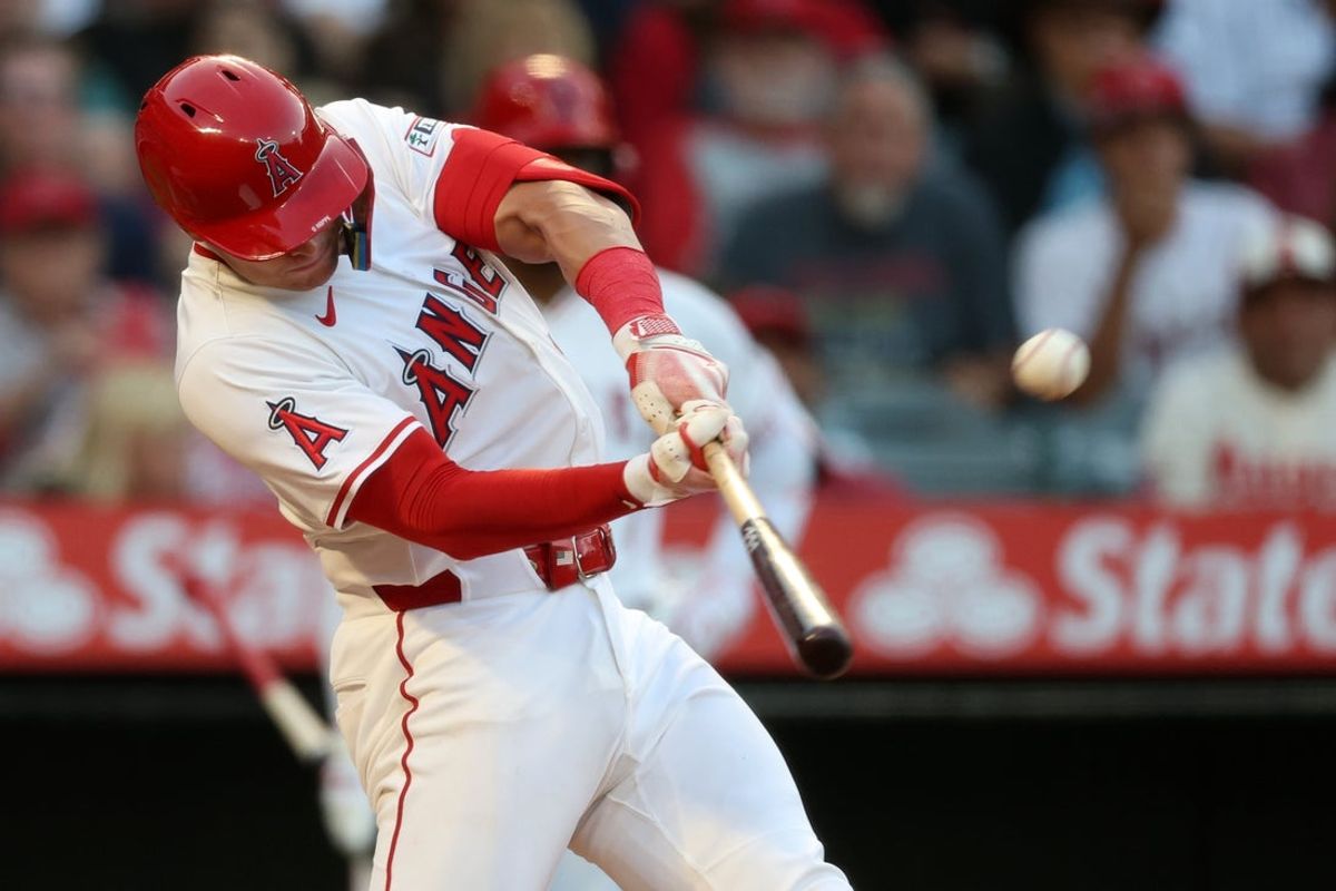 Jun 21, 2025; Anaheim, California, USA; Los Angeles Angels catcher Logan O'Hoppe (14) hits a home run during the third inning against the Houston Astros at Angel Stadium. Mandatory Credit: Kiyoshi Mio-Imagn Images