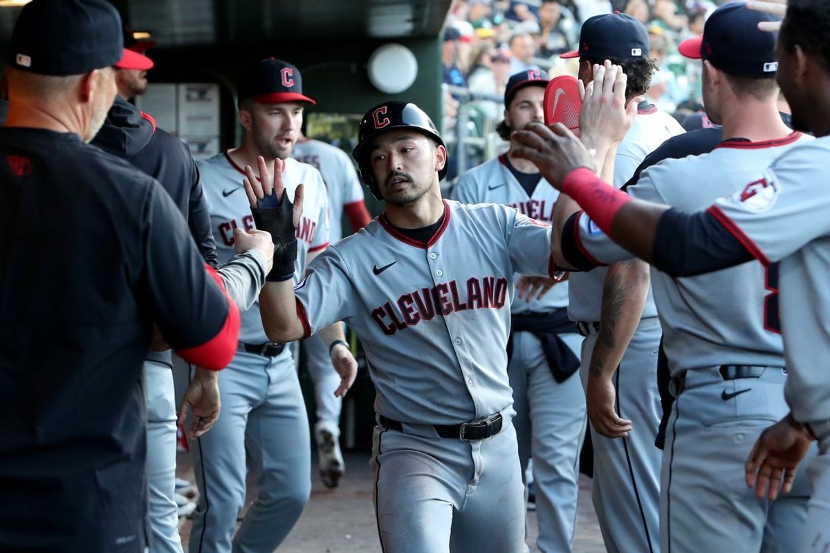 Jun 21, 2025; West Sacramento, California, USA; Cleveland Guardians left fielder Steven Kwan (38) celebrates with his teammates after scoring a run against the Athletics during the second inning at Sutter Health Park. Mandatory Credit: Dennis Lee-Imagn Images