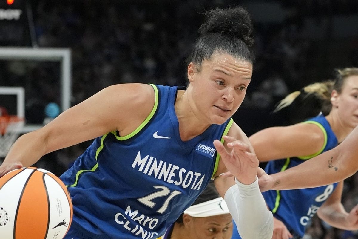 Jun 21, 2025; Minneapolis, Minnesota, USA; Minnesota Lynx guard Kayla McBride (21) goes to the basket against the Los Angeles Sparks in the third quarter at Target Center. Mandatory Credit: Bruce Kluckhohn-Imagn Images