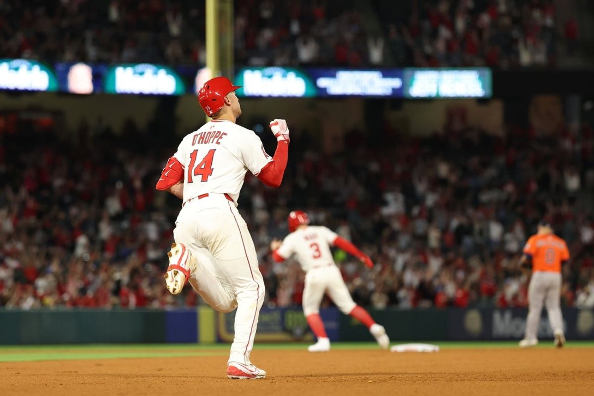 Jun 21, 2025; Anaheim, California, USA; Los Angeles Angels catcher Logan O'Hoppe (14) reacts after hitting a home run during the seventh inning against the Houston Astros at Angel Stadium. Mandatory Credit: Kiyoshi Mio-Imagn Images