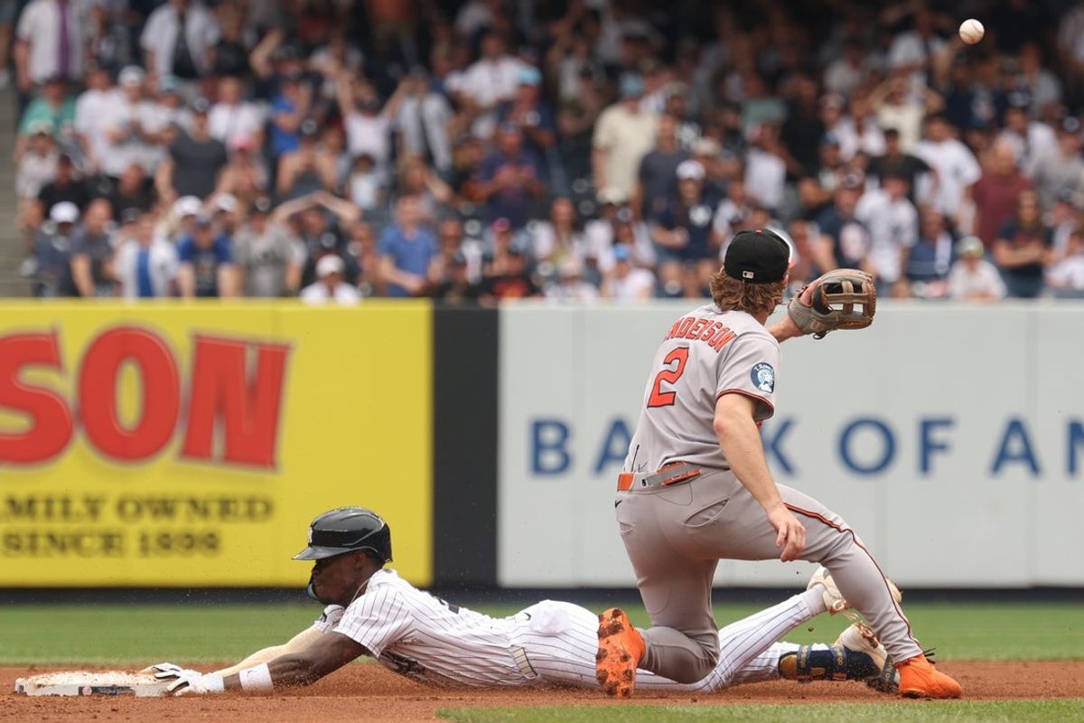 Jun 22, 2025; Bronx, New York, USA;  New York Yankees second baseman Jazz Chisholm Jr. (13) slides safely in to second base for a double as Baltimore Orioles shortstop Gunnar Henderson (2) waits for the throw during the third inning at Yankee Stadium. Mandatory Credit: Vincent Carchietta-Imagn Images