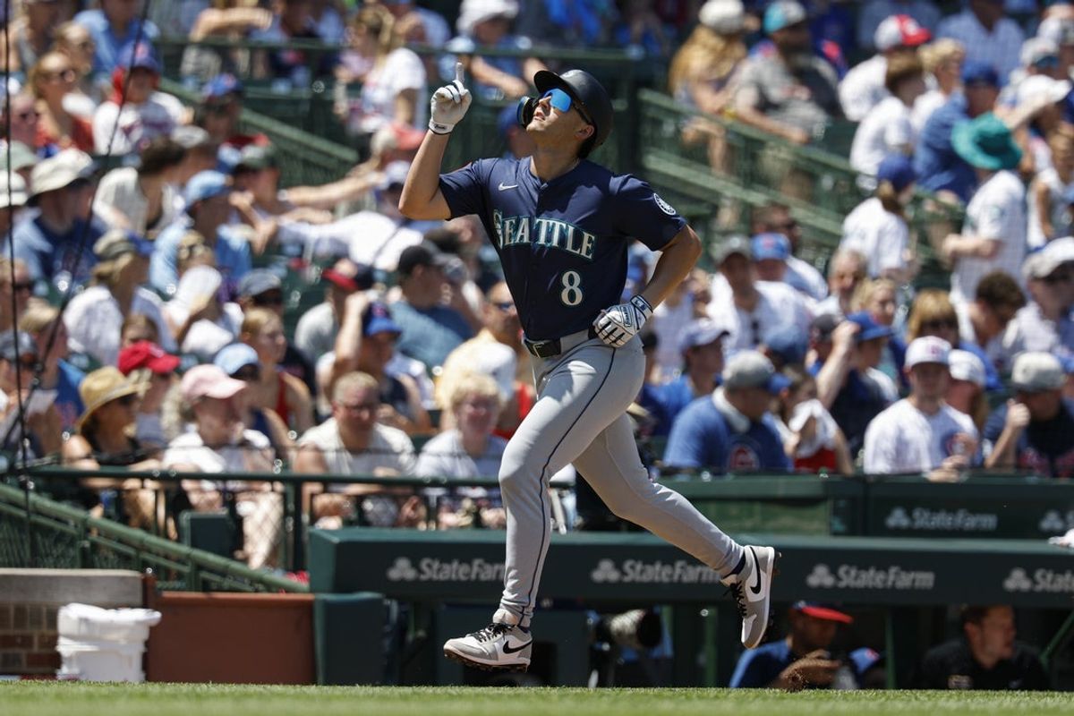 Jun 22, 2025; Chicago, Illinois, USA; Seattle Mariners right fielder Dominic Canzone (8) rounds the bases after hitting a solo home run against the Chicago Cubs during the second inning at Wrigley Field. Mandatory Credit: Kamil Krzaczynski-Imagn Images