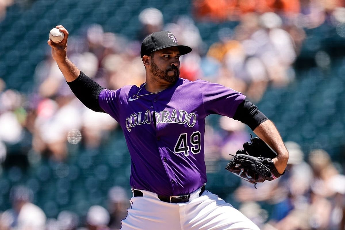 Jun 22, 2025; Denver, Colorado, USA; Colorado Rockies starting pitcher Antonio Senzatela (49) pitches in the first inning against the Arizona Diamondbacks at Coors Field. Mandatory Credit: Isaiah J. Downing-Imagn Images