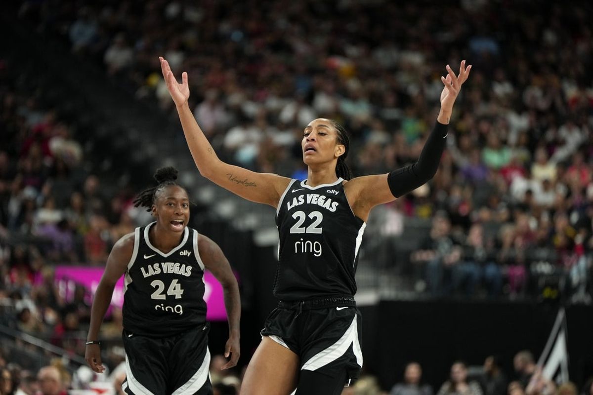 Jun 22, 2025; Las Vegas, Nevada, USA;  Las Vegas Aces center A'ja Wilson (22) reacts with guard Jewell Loyd (24) after scoring against the Indiana Fever during the first half of a WNBA basketball game at T-Mobile Arena. Mandatory Credit: Lucas Peltier-Imagn Images
