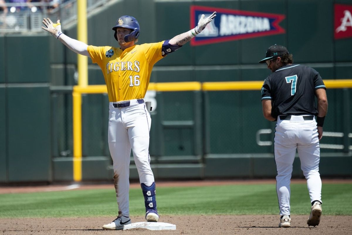 Jun 22, 2025; Omaha, Neb, USA;  LSU Tigers designated hitter Ethan Frey (16) gestures toward the bench after driving in a run with a double against the Coastal Carolina Chanticleers during the third inning at Charles Schwab Field. Mandatory Credit: Steven Branscombe-Imagn Images