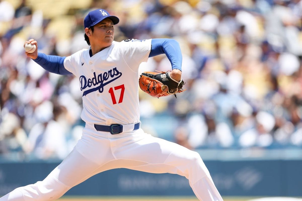 Jun 22, 2025; Los Angeles, California, USA; Los Angeles Dodgers two-way player Shohei Ohtani (17) pitches the ball during the second inning against Washington Nationals at Dodger Stadium. Mandatory Credit: Kiyoshi Mio-Imagn Images