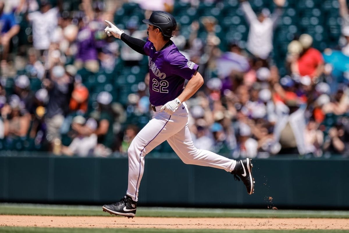Jun 22, 2025; Denver, Colorado, USA; Colorado Rockies right fielder Mickey Moniak (22) gestures as he rounds the bases on a three run home run in the fifth inning against the Arizona Diamondbacks at Coors Field. Mandatory Credit: Isaiah J. Downing-Imagn Images