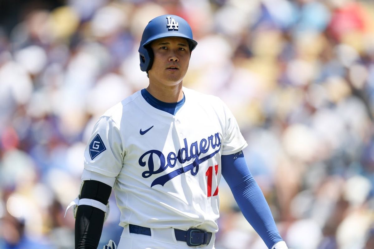 Jun 22, 2025; Los Angeles, California, USA; Los Angeles Dodgers two-way player Shohei Ohtani (17) walks back to the dugout after striking out during the third inning against Washington Nationals at Dodger Stadium. Mandatory Credit: Kiyoshi Mio-Imagn Images