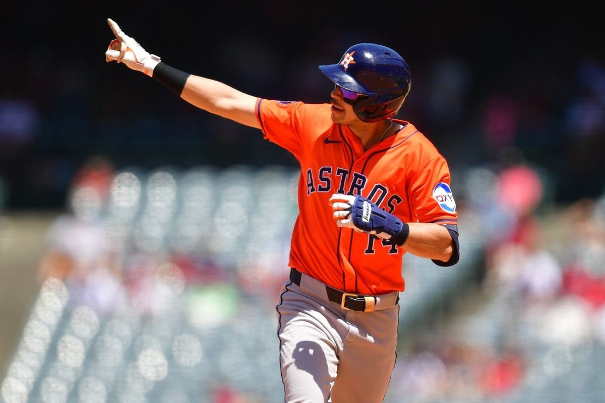 Jun 22, 2025; Anaheim, California, USA; Houston Astros second base Mauricio Dubon (14) runs the bases after hitting a two run home run against the Los Angeles Angels during the sixth inning at Angel Stadium. Mandatory Credit: Gary A. Vasquez-Imagn Images