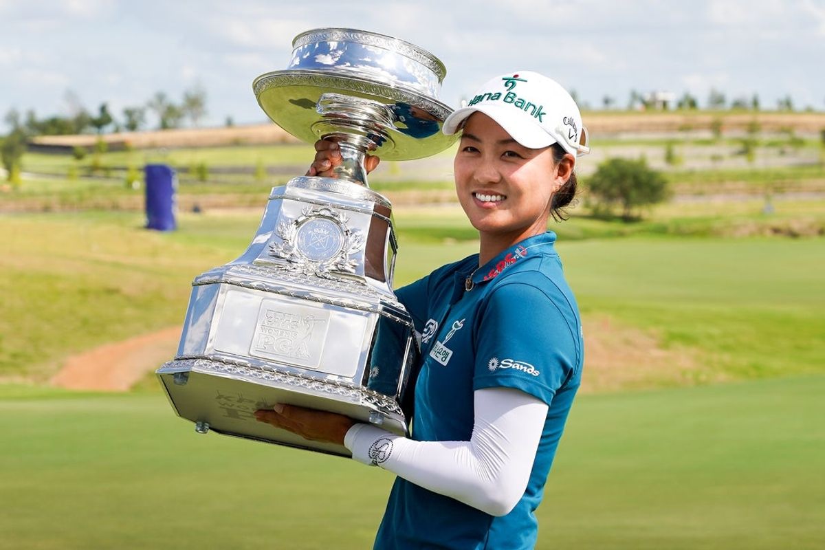 Jun 22, 2025; Frisco, Texas, USA; Minjee Lee poses with the winner's trophy following the final round of the KPMG Women's PGA Championship. Mandatory Credit: Raymond Carlin III-Imagn Images