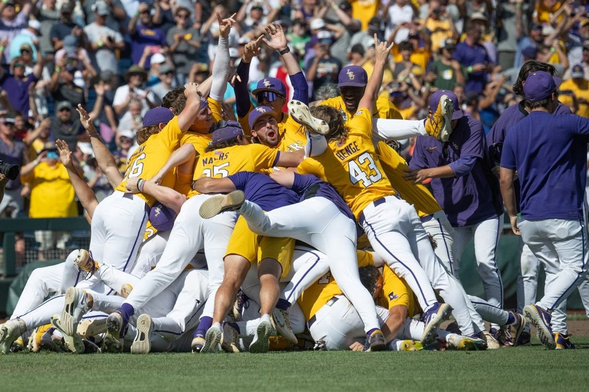 Jun 22, 2025; Omaha, Neb, USA;  The LSU Tigers celebrate after defeating the Coastal Carolina Chanticleers to win the College World Series at Charles Schwab Field. Mandatory Credit: Steven Branscombe-Imagn Images