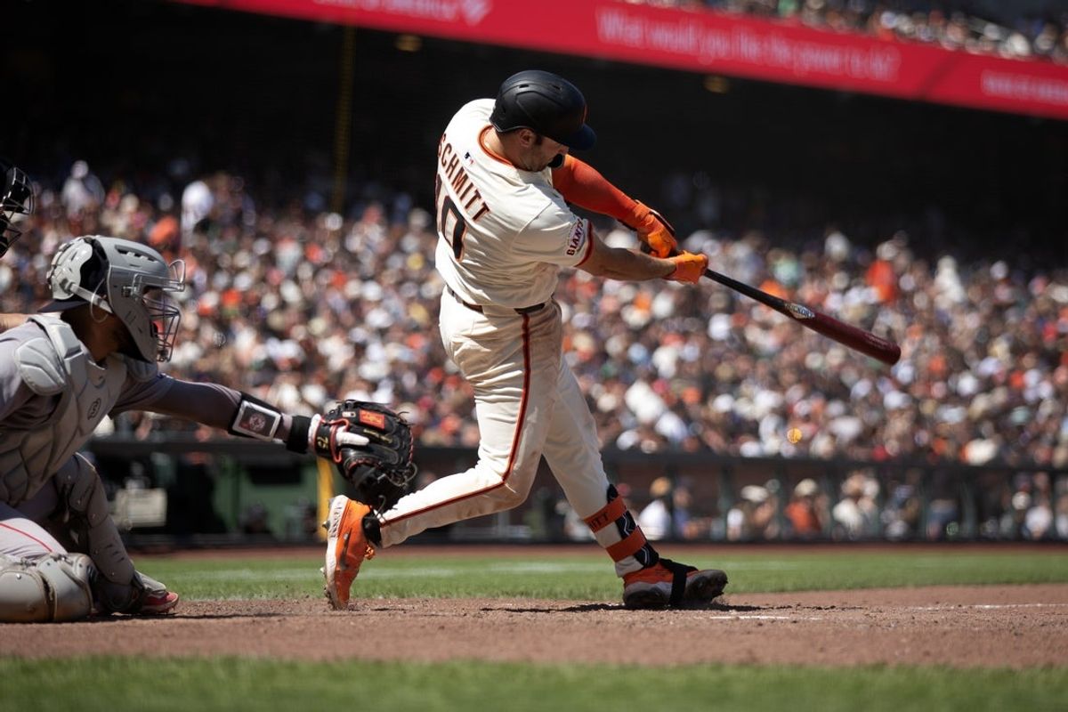 Jun 22, 2025; San Francisco, California, USA; San Francisco Giants third baseman Casey Schmitt (10) connects for a single during the eighth inning against the Boston Red Sox at Oracle Park. Mandatory Credit: D. Ross Cameron-Imagn Images