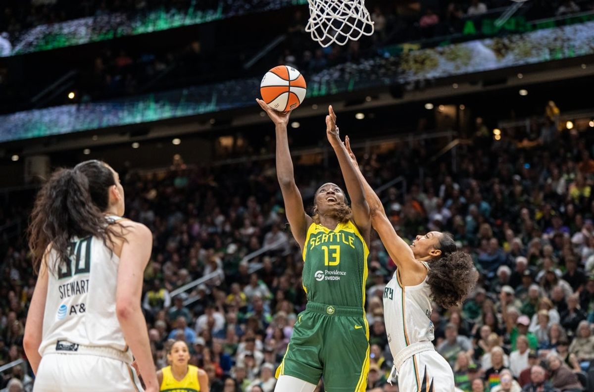Jun 22, 2025; Seattle, Washington, USA;  Seattle Storm forward Ezi Magbegor (13) shoots the ball against New York Liberty guard Rebekah Gardner (7) and forward Breanna Stewart (30) during the first half at Climate Pledge Arena. Mandatory Credit: Stephen Brashear-Imagn Images