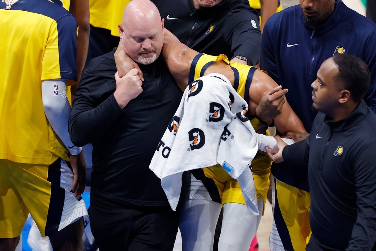 Jun 22, 2025; Oklahoma City, Oklahoma, USA; Indiana Pacers guard Tyrese Haliburton (0) is assisted after an apparent injury following a play against the Oklahoma City Thunder during the first half of game seven of the 2025 NBA Finals at Paycom Center. Mandatory Credit: Alonzo Adams-Imagn Images