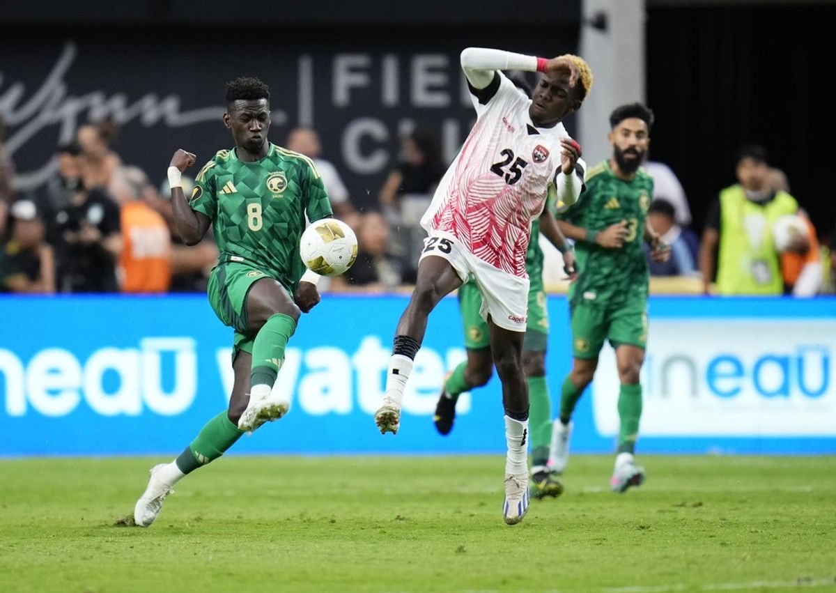 Jun 22, 2025; Las Vegas, Nevada, USA; Saudi Arabia forward Marwan Al Sahafi (8) and Trinidad and Tobago midfielder Kaihim Thomas (25) battle for control of the ball during the second half of a group stage match of the 2025 Gold Cup at Allegiant Stadium. Mandatory Credit: Matt Aguirre-Imagn Images