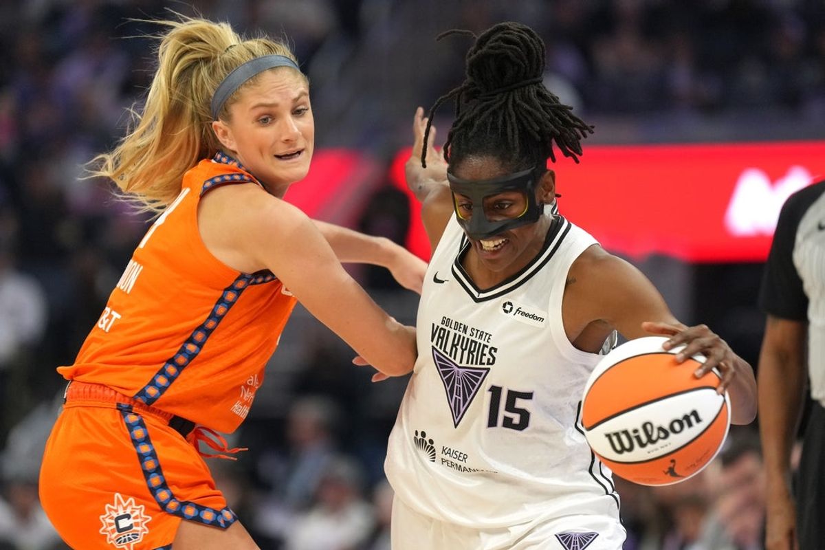 Jun 22, 2025; San Francisco, California, USA; Golden State Valkyries guard Tiffany Hayes (15) dribbles against Connecticut Sun guard Jacy Sheldon (left) during the first quarter at Chase Center. Mandatory Credit: Darren Yamashita-Imagn Images