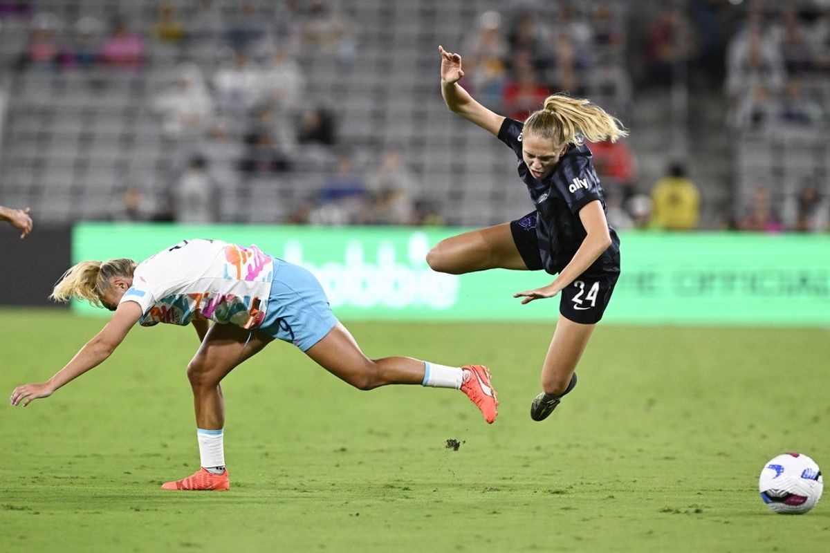 Jun 22, 2025; San Diego, California, USA; San Diego Wave FC forward Adriana Leon (9) and Washington Spirit defender Esme Morgan (24) during the second half at Snapdragon Stadium. Mandatory Credit: Denis Poroy-Imagn Images
