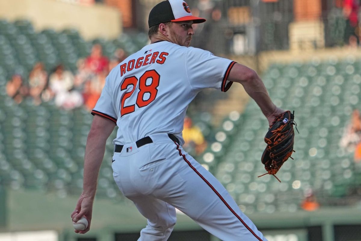 Jun 23, 2025; Baltimore, Maryland, USA; Baltimore Orioles pitcher Trevor Rogers (28) delivers in the first inning against the Texas Rangers at Oriole Park at Camden Yards. Mandatory Credit: Mitch Stringer-Imagn Images