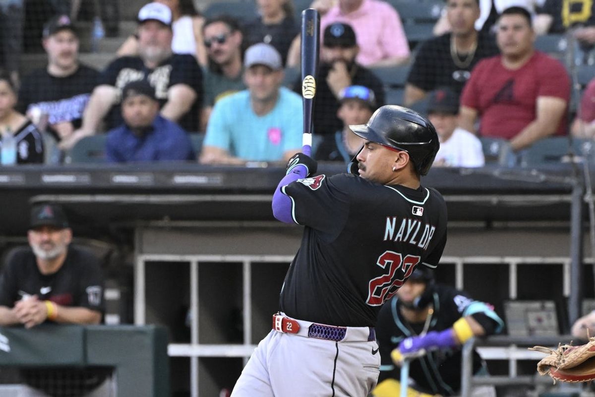 Jun 23, 2025; Chicago, Illinois, USA;  Arizona Diamondbacks first base Josh Naylor (22) hits a two run double during the first inning against the Chicago White Sox at Rate Field. Mandatory Credit: Matt Marton-Imagn Images