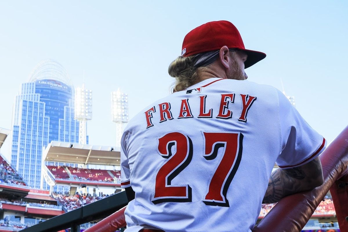 Jun 23, 2025; Cincinnati, Ohio, USA; Cincinnati Reds outfielder Jake Fraley (27) stands in the dugout before the game against the New York Yankees at Great American Ball Park. Mandatory Credit: Katie Stratman-Imagn Images
