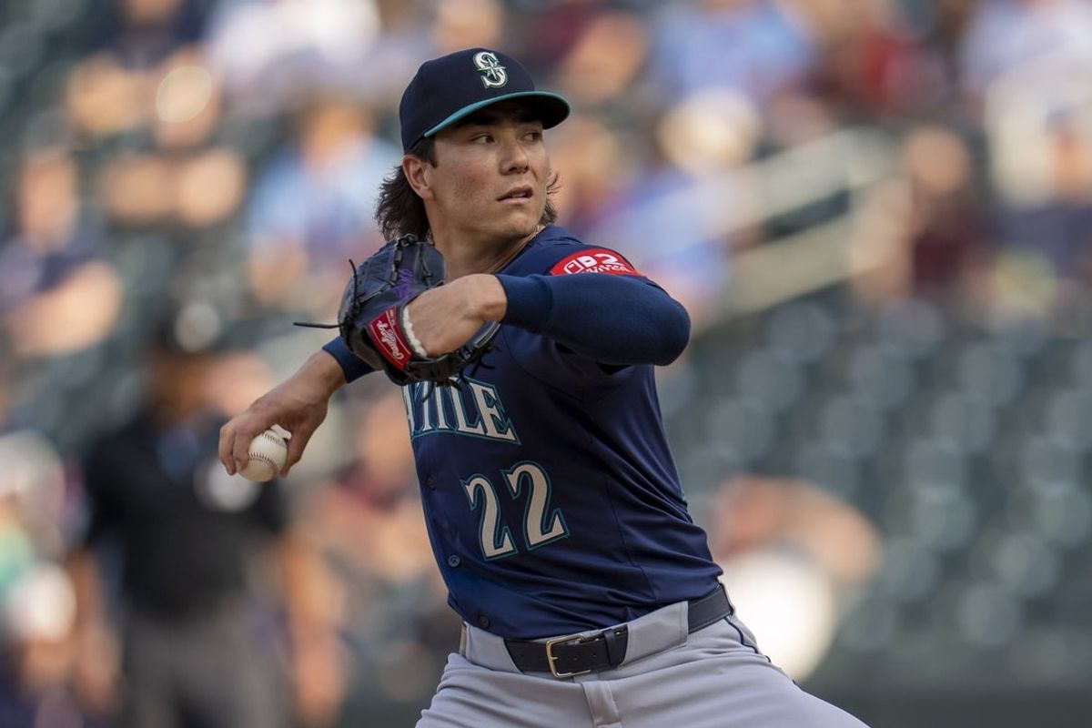 Jun 23, 2025; Minneapolis, Minnesota, USA; Seattle Mariners starting pitcher Bryan Woo (22) delivers a pitch against the Minnesota Twins in the first inning at Target Field. Mandatory Credit: Jesse Johnson-Imagn Images