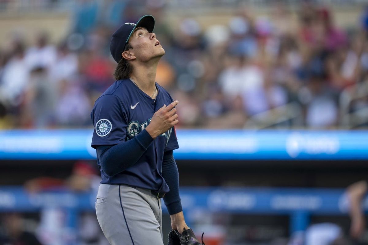 Jun 23, 2025; Minneapolis, Minnesota, USA; Seattle Mariners starting pitcher Bryan Woo (22) celebrates after getting a strike out against the Minnesota Twins in the second inning at Target Field. Mandatory Credit: Jesse Johnson-Imagn Images