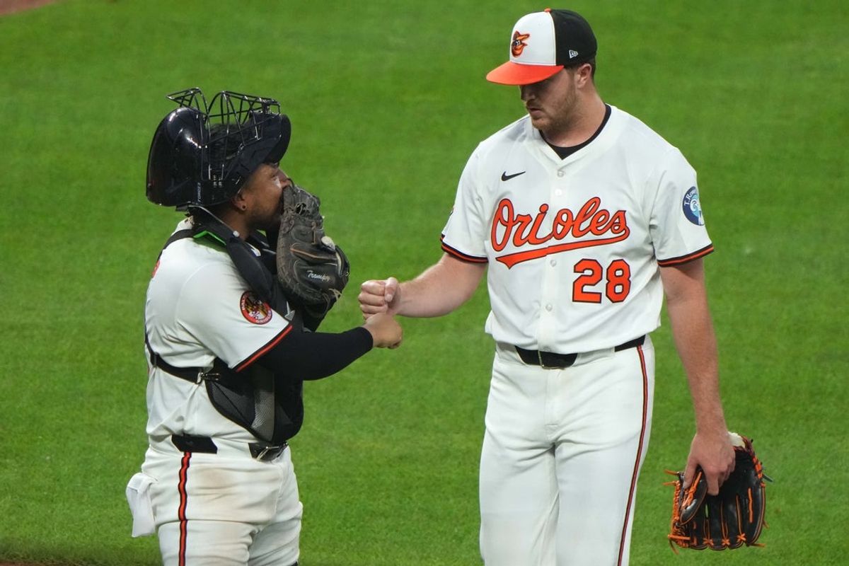 Jun 23, 2025; Baltimore, Maryland, USA; Baltimore Orioles pitcher Trevor Rogers (28) greeted by catcher Chandler Tromp (41) after pitching eight full innings against the Texas Rangers at Oriole Park at Camden Yards. Mandatory Credit: Mitch Stringer-Imagn Images