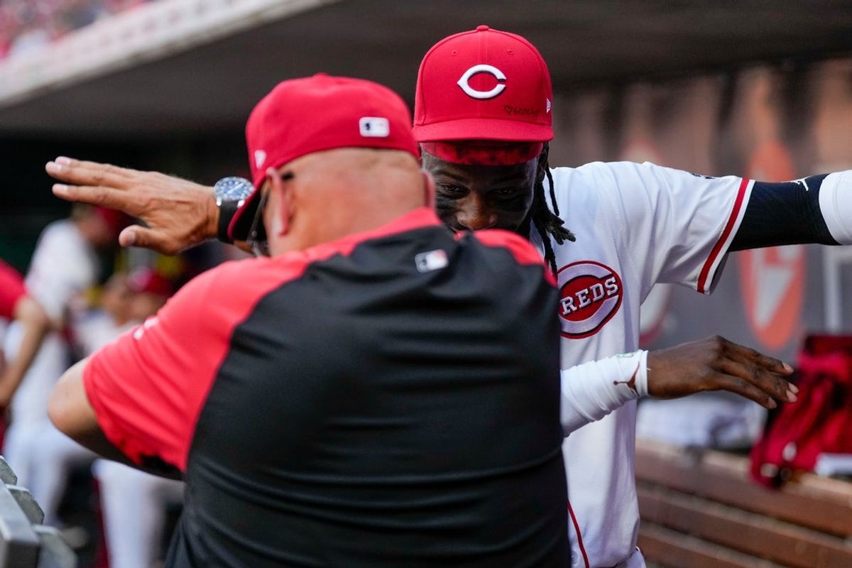 Cincinnati Reds manager Terry Francona (77) and shortstop Elly De La Cruz (44) dab in the dugout before the first inning of the MLB interleague game between the Cincinnati Reds and the New York Yankees at Great American Ball Park in downtown Cincinnati on Monday, June 23, 2025.