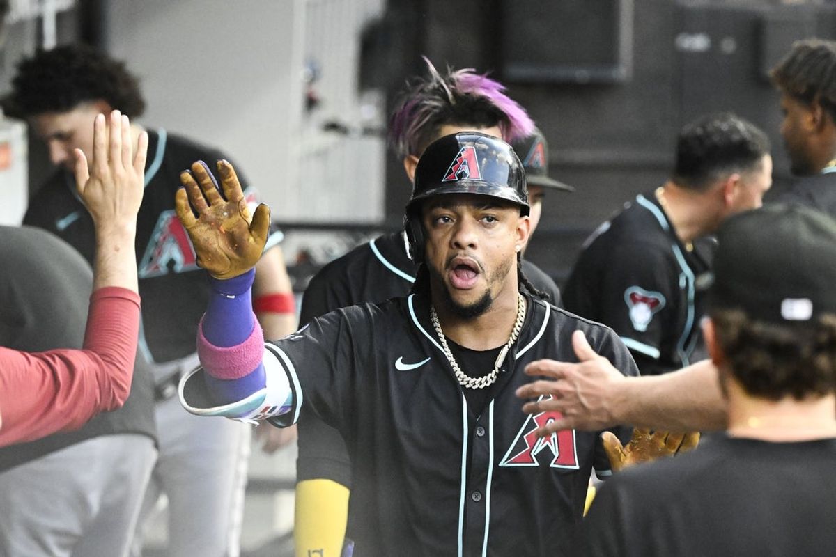 Jun 23, 2025; Chicago, Illinois, USA;  Arizona Diamondbacks second base Ketel Marte (4) celebrates in the dugout after he hits a home run against the Chicago White Sox during the fourth inning at Rate Field. Mandatory Credit: Matt Marton-Imagn Images