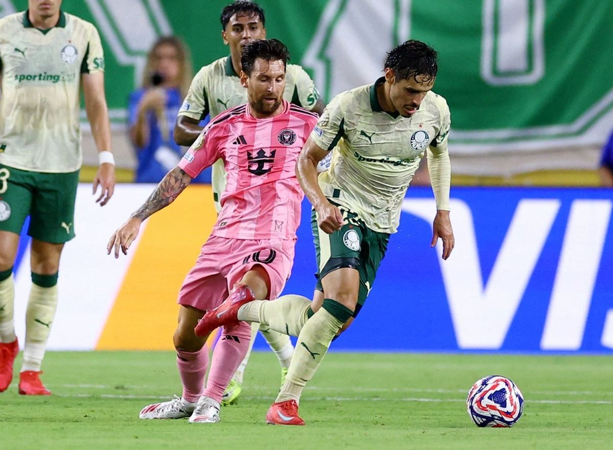 [Subscription Customers Only] Jun 23, 2025; Miami Gardens, Florida, USA; Inter Miami CF forward Lionel Messi (10) is given a yellow card for this foul against SE Palmeiras midfielder Raphael Veiga (23) during the first half of a group stage match of the 2025 FIFA Club World Cup at Hard Rock Stadium. Mandatory Credit: Hannah Mckay-Reuters via Imagn Images
