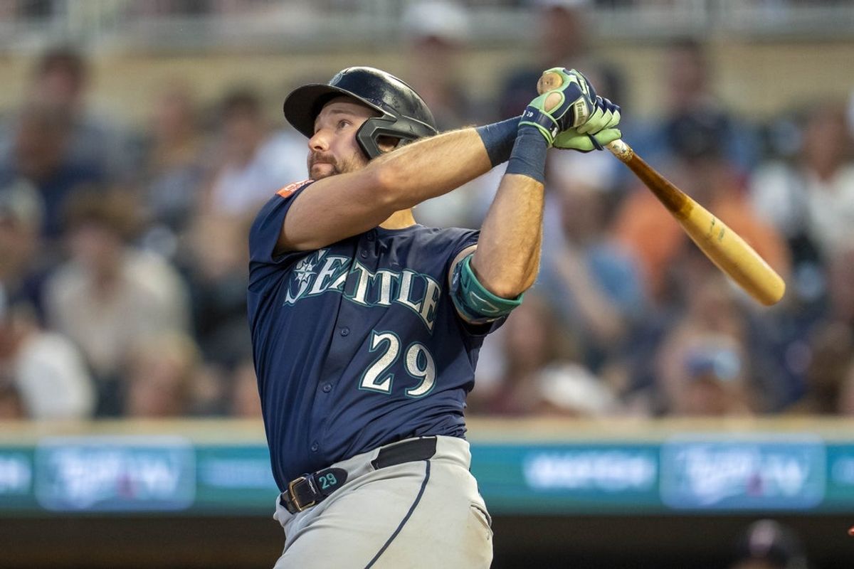 Jun 23, 2025; Minneapolis, Minnesota, USA; Seattle Mariners catcher Cal Raleigh (29) hits a two run home run against the Minnesota Twins in the ninth inning at Target Field. Mandatory Credit: Jesse Johnson-Imagn Images