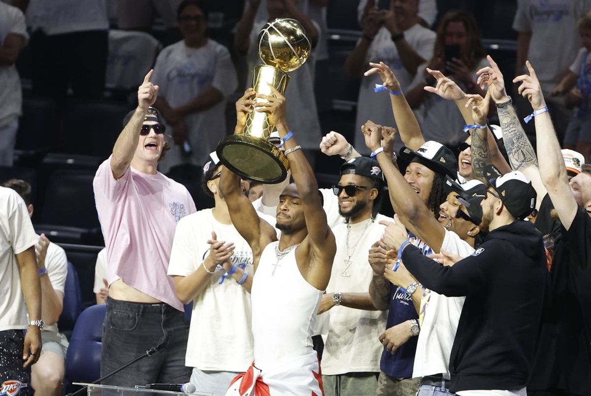 Jun 24, 2025; Oklahoma City, OK, USA; Oklahoma City Thunder guard Shai Gilgeous-Alexander (2) holds up the Larry OíBrien Championship Trophy during the Champions Opening Ceremony for the parade inside the Paycom Center. Mandatory Credit: Alonzo Adams-Imagn Images